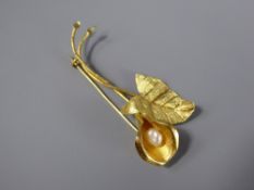 An 18ct Yellow Gold and Baroque Pearl Lily Brooch, approx 6.5 cms and 6 gms.