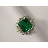 A Spectacular 5.40ct Emerald and Diamond Ring set in and 18ct White Gold mount. The vivid green