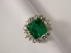 A Spectacular 5.40ct Emerald and Diamond Ring set in and 18ct White Gold mount. The vivid green