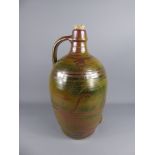 A Large Winchcombe Pottery Flagon, with green and ruby glaze, approx 55 cms.