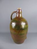 A Large Winchcombe Pottery Flagon, with green and ruby glaze, approx 55 cms.