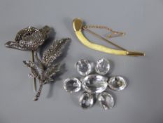 A Silver and Marcasite Poppy Brooch approx 19.5 gms, mm, T.M. & Co., together with a silver and