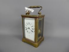 A French Brass Cased Carriage Clock, white enamel face with Roman dial stamped Byrne Paris, approx