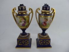 A Pair of Antique 'Royal Vienna' Urns and Covers, hand-painted with Arcadian scenes, approx 23