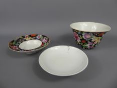 A Delicate Enamelled Black-Ground Famille-Rose Bowl, together with a tea bowl and saucer, Qianlong