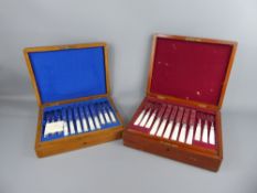 A Boxed Set of Twelve French Mother of Pearl and Silver Plated Fruit Knives and Forks, together with