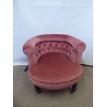 An Edwardian Tub Chair, in pink upholstery.