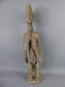 A West African Wooden Fertility Figure, depicting an expectant woman,approx 60 cms. Provenance: