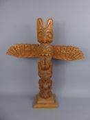 A Native American Carved Totem, depicting totem animals including hawk, wolf, bear approx 50 cms