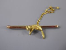 A 9ct Yellow Gold Fox Stock Pin, presented in a Harrods box.
