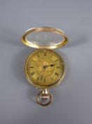 A Lady's 14ct Yellow Gold Open Facet Pocket Watch. The watch having a gold coloured face with