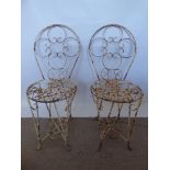 Two Antique Wrought Iron Garden Chairs with round seats, approx 88 x 36 cms dia. (seat)