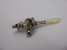 A Victorian Silver Rattle with mother of pearl handle.