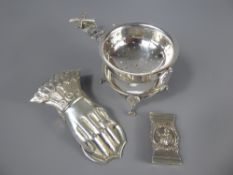 A Silver Metal Dutch Style Tea Strainer, the strainer on claw feet, together with a letter clip