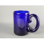 A Mexican Blue Glass Beer Tankard, etched with 'Canal Guadalajara', approx 15 x 10 cms dia. together