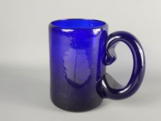 A Mexican Blue Glass Beer Tankard, etched with 'Canal Guadalajara', approx 15 x 10 cms dia. together