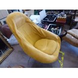 A Vintage Retro Lurashell Chair, the chair covered by a mustard coloured loose cover over sage