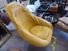 A Vintage Retro Lurashell Chair, the chair covered by a mustard coloured loose cover over sage