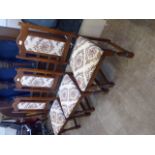 Six 'Old Charm' Dining Chairs, two carvers and four straight chairs with tapestry upholstery.