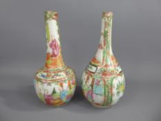 A Pair of Cantonese 19th Century Famille Rose Bottle Vases, character marks to base, approx 21 cms