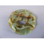 A Chinese Jade Amulet, approx 9 x 9 cms diameter.