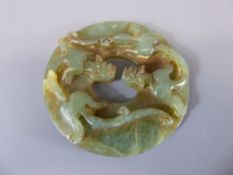 A Chinese Jade Amulet, approx 9 x 9 cms diameter.