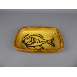 A Winchcombe Pottery Earthenware rectangular yellow-glazed dish (1940/50's), decorated with a