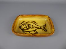 A Winchcombe Pottery Earthenware rectangular yellow-glazed dish (1940/50's), decorated with a
