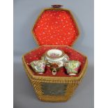 A Late 19th Century Chinese Tea Basket, containing a Famille 'Rose Medallion' tea pot and cover