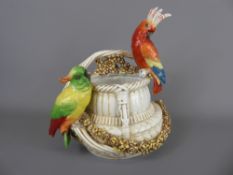 A Continental Basket, moulded with two parakeets, marks to base, approx 26 cms (wf).