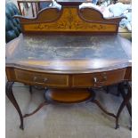 An Edwardian Desk, with a decoratively inlaid mantle and brown leather top above two drawers, on