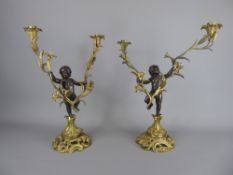 A Pair of Antique Bronze and Gilt Figural Candelabra, approx 43 cms.