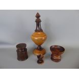 Four Treen Items, including a Lignum Vitae Snuff Pourer, pair of pounce pots and a small egg cup (