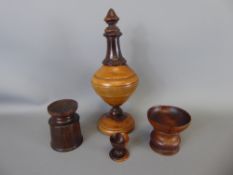 Four Treen Items, including a Lignum Vitae Snuff Pourer, pair of pounce pots and a small egg cup (