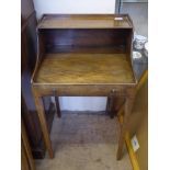 A Georgian Mahogany Antique Child's Desk, with an open front and false drawer with brass knob