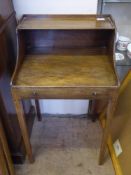 A Georgian Mahogany Antique Child's Desk, with an open front and false drawer with brass knob