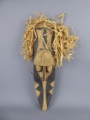 An Oceanic Tribal Mask, elongated facial expression, believed to be Igiri wood, the frame of plaited