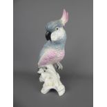 A Crown Staffordshire Porcelain Pink and Grey Cockatoo, designed and modelled by J.T. Jones,