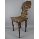 An Apprentice Welsh-Style Spinning Chair, with decorative carving to the back rest and seat on