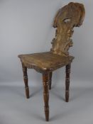 An Apprentice Welsh-Style Spinning Chair, with decorative carving to the back rest and seat on