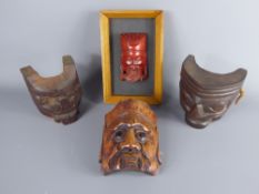 Four Small Japanese Wooden Noh Masks, two dark wood (approx 10 cms) and one with black glass eyes (