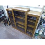 An Art Deco Walnut Bookcase, three shelves behind double astral glazed doors, approx 122 x 112 cms.