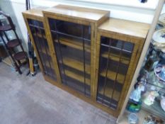 An Art Deco Walnut Bookcase, three shelves behind double astral glazed doors, approx 122 x 112 cms.