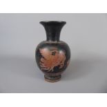 An Ancient Greek Terracotta Oil Jug, depicting a winged figure, approx 15 cms.