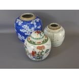 A Chinese Blue and White Ginger Jar Prunus design, together with a Famille Rose Ginger Jar and one