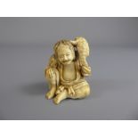 Antique Japanese Netsuke, carved figure of a seated man with a salamander on his shoulder, approx