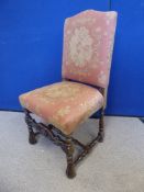 A Pair of Antique Mahogany Baronial Hall Chairs, with carved stretchers and feet, upholstered in