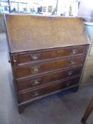 An Antique Oak Drop Front Bureau, the bureau with fitted pigeon hole interior and three drawers on