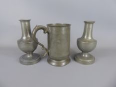 A Pair of Pewter Vessels approx 19 cms high, together with a glass bottomed pewter tankard, approx