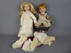 Two Bisque-Headed Dolls, with bisque hands and legs, approx 40 cms with a small quantity of